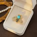 Detailed close-up of the exquisite rhinestone bee brooch, showcasing delicate crystal wings. - Style 6