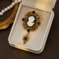 Vintage cameo brooch with sparkling rhinestones and elegant gold hollow-out design detail. - Style 2
