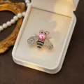 Exquisite bee rhinestone brooch detail, featuring sparkling crystals and a chic pink pearl. - Style 12