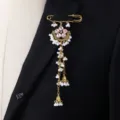 Elegant South-East Asian style gold brooch with pink crystal flower and pearl tassels. - Pink