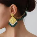 Ethnic style carved hollow gold-plated stud earrings with green beads and pearl tassel chain. - Gold Green