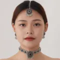 Vintage Indian ethnic jewelry set including choker necklace, earrings, and maang tikka. - Silver Black