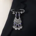 Bohemian retro carved brooch with blue rhinestones and elegant hanging tassel butterfly details. - Blue
