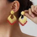 Exquisite vintage gold rhombus filigree earrings featuring striking red bead fringe. - Gold Red
