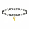 Close-up detail of black tattoo choker necklace with cute yellow peeled banana pendant design. - Banana Charm