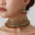 Bohemian ethnic alloy choker necklace and matching jhumka earrings set detail view. - Gold Red