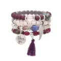 Bohemian multi-layer beaded bracelet set with tassel and wing charm, stylish fashion jewelry details. - Purple