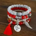Bohemian multi-layer beaded bracelet set with red tassel and vintage metal charms. - Red