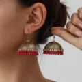 Vintage ethnic style gold-tone jhumka drop earrings with delicate red bead fringe details for women. - Gold Rose Red