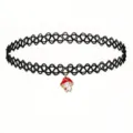 Close-up detail of a black tattoo stretch choker necklace with a cute mushroom pendant. - Red Mushroom Charm