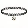 Closeup detail of a black tattoo choker necklace with a cute soccer ball pendant. - Black and White Football Pendant