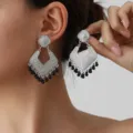 Vintage silver geometric dangle earrings with black bead tassels, retro ethnic style chic. - Silver Black