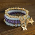 Bohemian multi-layer beaded bracelet set with gold butterfly charms and crystal beads. - Purple