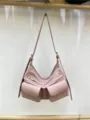 Pink motorcycle style shoulder bag with double front pockets and zippers for daily use. - Pink