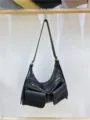 Black motorcycle style crossbody shoulder bag with multi pockets and metal zippers for women. - Black