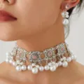 Vintage silver tone choker necklace and matching earrings set featuring pink rhinestones and pearls. - Pink