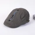 Detailed view of the stylish dark gray flat cap with a decorative zipper stripe and unique design. - Adjustable / D - Army Green