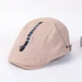 Khaki fashion beret duckbill cap detail view with zipper and letter ribbon for street wear. - Adjustable / D-Beige