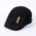 Detail view of a black cotton flat cap, stylish leather buckle, vintage street style hat. - Adjustable / C-Black