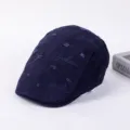 Distressed denim-style flat cap with fashion embroidery, casual unisex beret hat detail view. - Adjustable / B-Navy Blue