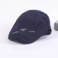 Men's dark blue cotton flat cap, casual ivy beret hat with stylish metal badge detail. - Adjustable / Navy Blue