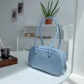 Light blue vintage oil-wax texture underarm shoulder bag for women, chic Boston handbag detail. - Blue