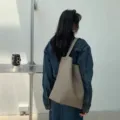 Minimalist PU leather shoulder tote bag, large capacity solid color bucket bag for daily use. - Gray