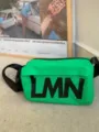 Green waterproof pillow crossbody bag with bold black letter print for casual sports use. - BV Green