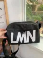 Black waterproof nylon messenger shoulder bag with bold LMN letter print for daily casual use. - Black