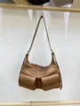 Brown leather motorcycle shoulder bag with multi-pockets and zippers, detailed close-up shot. - Earthy Yellow