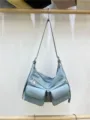 Light blue motorcycle shoulder bag detail, utility style crossbody bag, double zipper pockets. - Blue