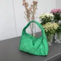 Green quilted shoulder bag detail showing soft fabric texture and neat diamond stitching pattern. - Underarm Shoulder Bag / Green