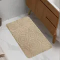 Beige flannel swirl embossed bathroom floor mat, absorbent and anti-slip bath rug. - Swirl Pattern Camel
