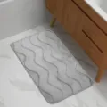 Detail shot of grey wave bath mat on marble floor, showing soft texture and anti-slip backing. - 42*38 Cover / Wavy Light Gray