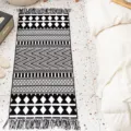 Nordic ethnic style black and white geometric woven rug with tassels for bedroom bedside - Ferros