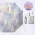 Sombrilla plegable con estampado floral, estructura dorada y alta proteccion UV. - Resplandor de glicinia - Paraguas con revestimiento de color y mango dorado