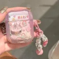 Detailed view of a cute pink 3D bunny AirPods case featuring a decorative beaded keychain - For airpods 1/2nd Gen / 3D House Rabbit Case With Pendant