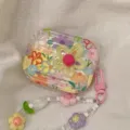 Detail view of floral AirPods case featuring 3D yellow flower and a beaded charm strap. - For airpods 1/2nd Gen / 3D Colorful Flower Case With Pendant