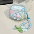 Detail view of a cute 3D blue flower AirPods case with a floral beaded charm strap - For airpods 1/2nd Gen / 3D Blue Flower Case With Pendant