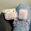 Detailed view of lilac AirPods Pro case with 3D pink flower and matching floral charm - 3D Pink Cherry Blossom Case With Pendant