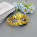 Gold masquerade mask with rhinestones and tassels, half-face phoenix design for party dress up. - Gold