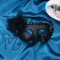 Black feather masquerade mask with blue rhinestones, elegant half-face party prop variant. - Blue Rhinestone