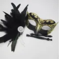 Close-up detail of masquerade feather mask with sparkling rhinestones and detachable handles. - Detachable Feather Tassel / Gold