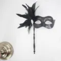 Black masquerade mask with feathers, rhinestones and handle for party costume ball dress up. - Detachable Feather Tassel / Black