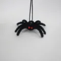 Black plush spider hanging ornament with red rhinestone eyes, perfect for Halloween decor. - Black Style with Red Rhinestone Eyes / 1 Piece