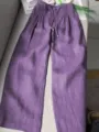 Purple casual wide-leg pants detail view, featuring a high waist and convenient drawstring. - Purple