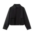 Detailed view of black cropped trench jacket with lapel collar and layered front flap design. - XS / Black