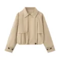 Close-up detail of stylish khaki short trench coat featuring lapel collar and cuffs. - XS / Khaki