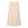 Detailed view of a stylish beige pleated midi skirt featuring wide waistband and flowing drape. - XS / Bottoms / Beige