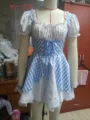 Detailed view of blue and white checkered maid cosplay dress with lace and bow accents. - Blue Plaid